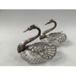 A PAIR OF .925 SILVER MOUNTED CUT GLASS BONBON DISHES IN THE FORM OF SWANS, the hinged wings pierced