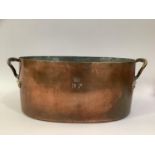 A LATE 19TH CENTURY FRENCH COPPER STOCKPAN with twin handles, oval, stamped D.P and crown to front
