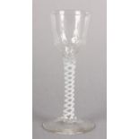 A MID 18TH CENTURY WINE GLASS, the ogee bowl part honeycomb and part twisted rib moulded on a single