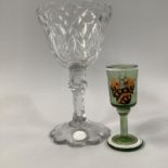 A MID 19TH CENTURY CONTINENTAL GREEN GLASS ARMORIAL TOT GLASS, the bowl enamelled with a coat of