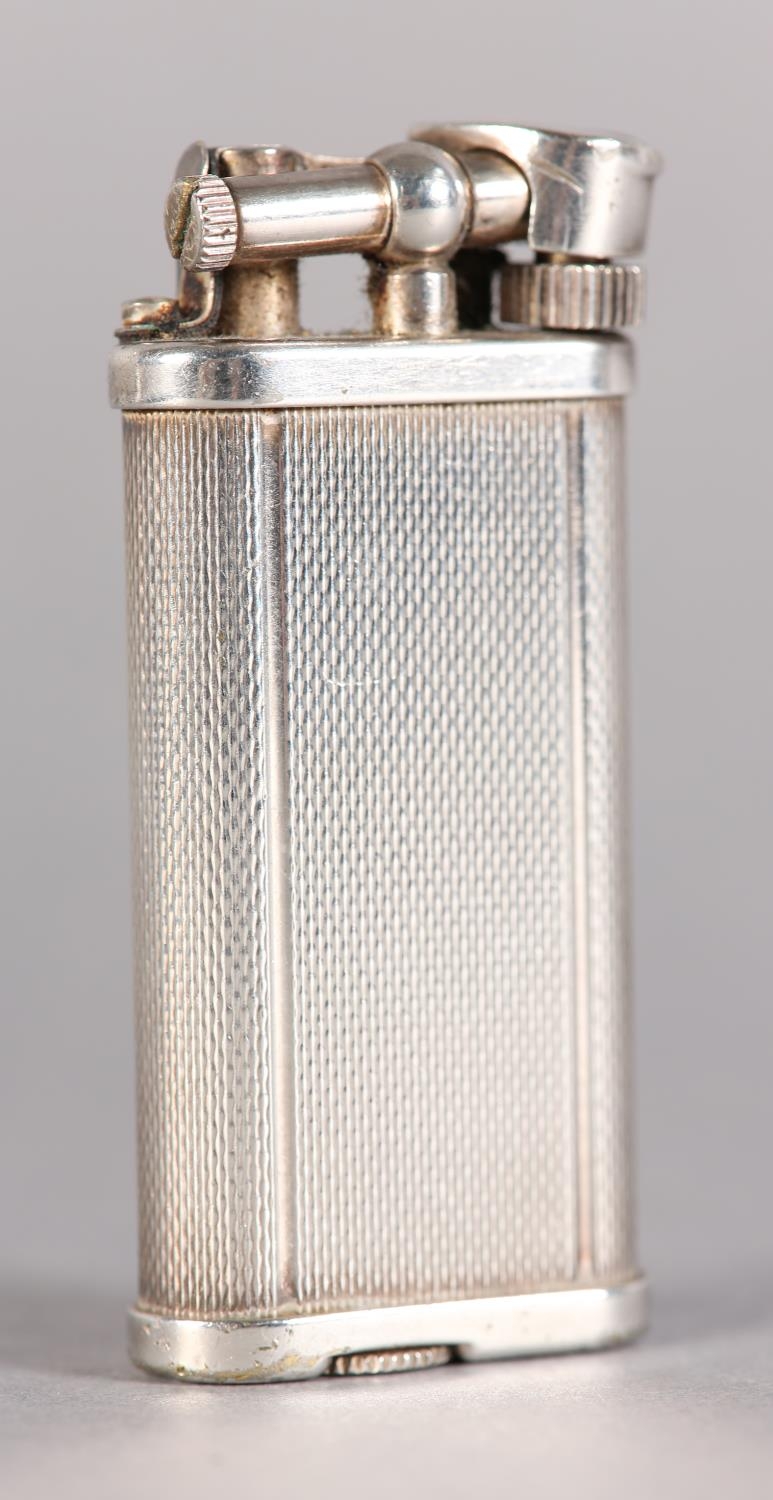A DUNHILL 'UNIQUE' LIFT ARM PETROL LIGHTER No. 484316 engine turned, silver plated, signed and - Image 3 of 6