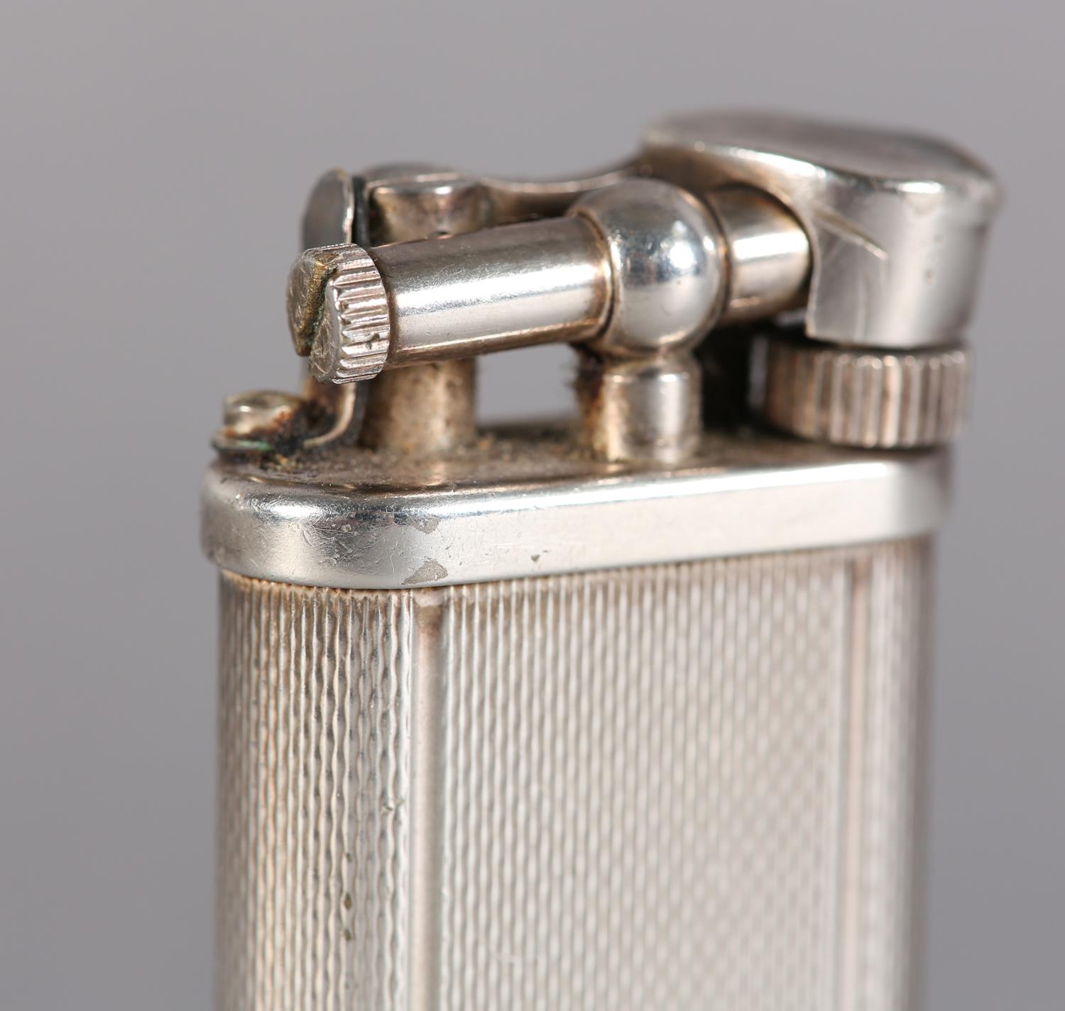 A DUNHILL 'UNIQUE' LIFT ARM PETROL LIGHTER No. 484316 engine turned, silver plated, signed and - Image 4 of 6