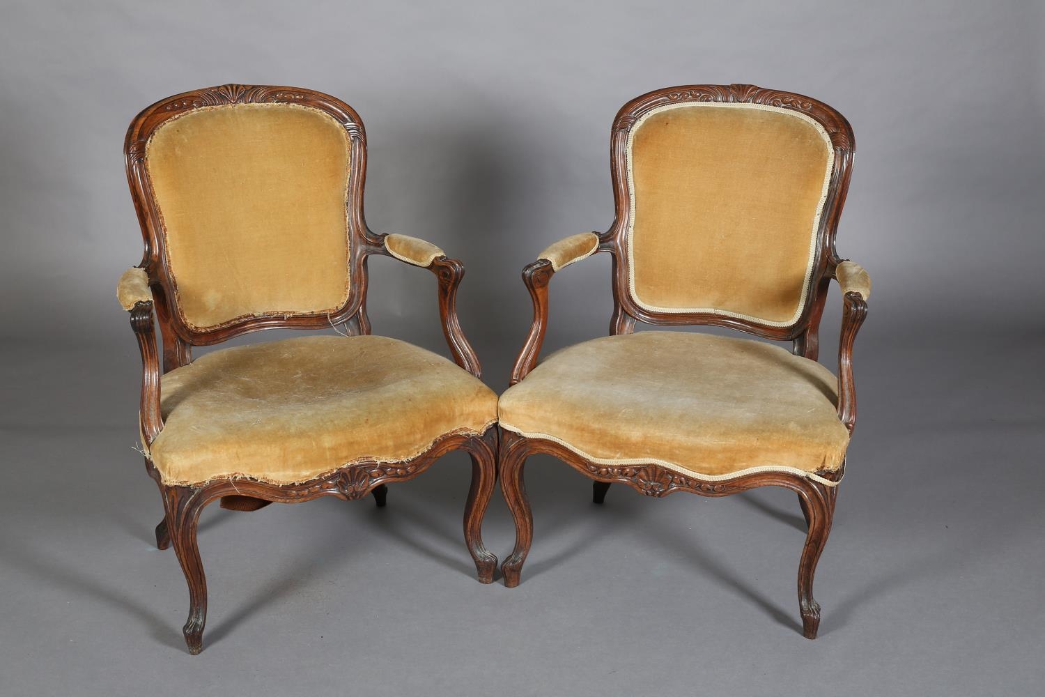 A PAIR OF LATE 19TH CENTURY WALNUT OPEN ARMCHAIRS IN THE FRENCH MANNER, having a moulded