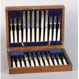 A GEORGE V OAK CANTEEN OF TWELVE SILVER AND MOTHER-OF-PEARL HANDLED FRUIT KNIVES, Sheffield 1926,