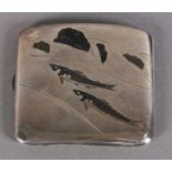 A JAPANESE SILVER CIGARETTE CASE, inlaid with fish in bronze and gilt metals, c.1920, in leather