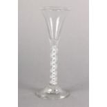 A MID 18TH CENTURY ENGLISH LIQUEUER GLASS with small trumpet bowl, double series opaque twist