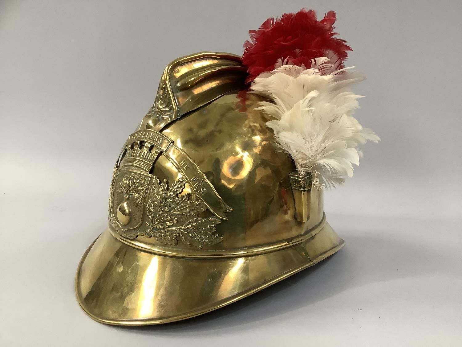 A 19TH CENTURY FRENCH SAPEURS POMPIERS DE FES BRASS FIREMAN'S HELMET, of Adrian pattern style,