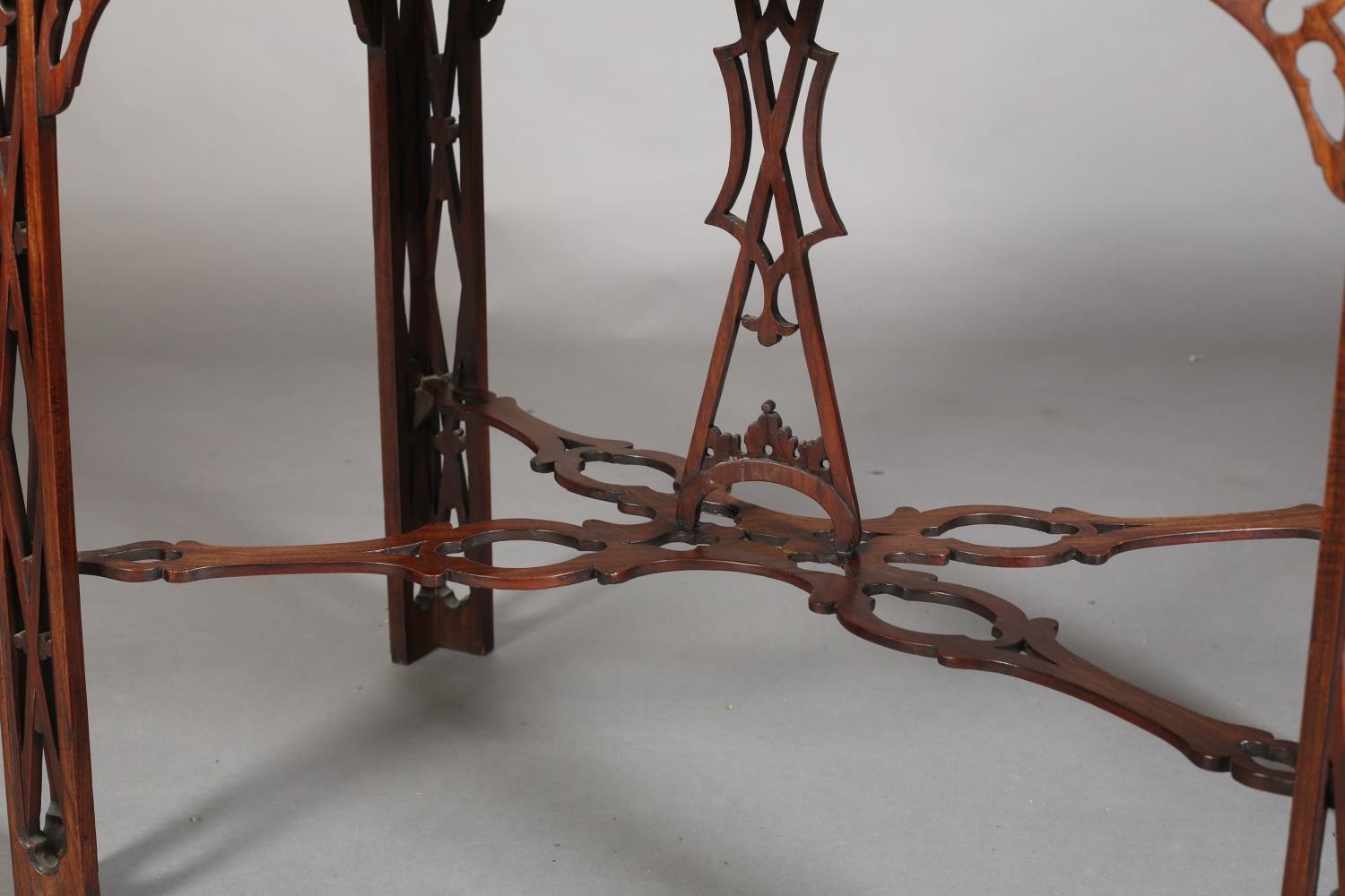 A GEORGE III MAHOGANY TEA TABLE of rectangular serpentine outline with fretwork gallery apron, angle - Image 4 of 6