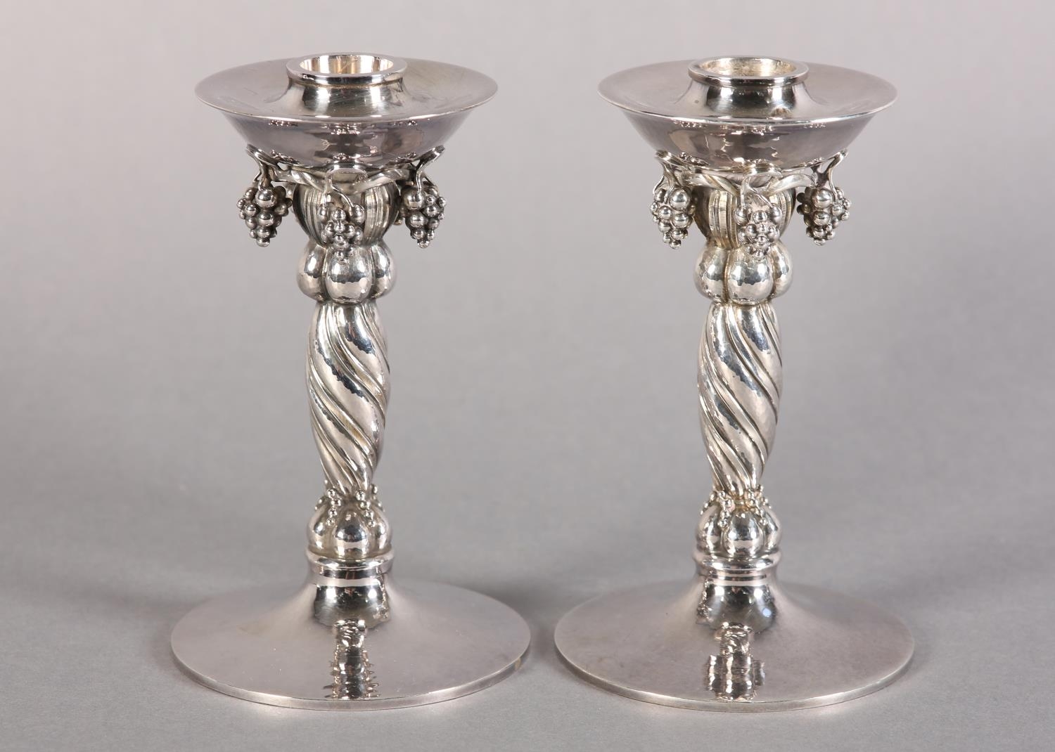A PAIR OF GEORG JENSEN SILVER GRAPEVINE CANDLESTICKS No. 263A both signed Y10 9255 Denmark Georg