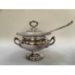 A silver plate on copper tureen with cover and associated ladle, twin handles with heavily moulded