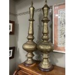 Pair of Arabian pierced metal standing lamps on wooden bases, 97cm high