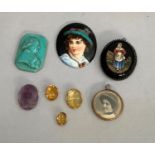 A group of late 19th. and early 20th. Century loose gemstones and an Amethyst cameo female portrait,