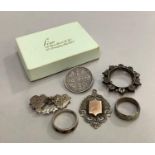 A collection of late 19th/early 20th century silver jewellery with a fob medallion, red paste set