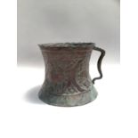 Eastern water pot with hammered decoration depicting deer, with geometric handle and scalloped