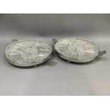 A pair of silver plated and cut glass hors d'oeuvres dishes, circular with twin handles of Art