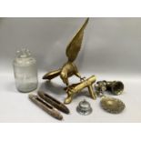 Brass figure of an eagle, carbine lamp, demijohn etc.