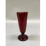 Ruby red glass vase of tapered form with scalloped rim on circular base, 20cm high
