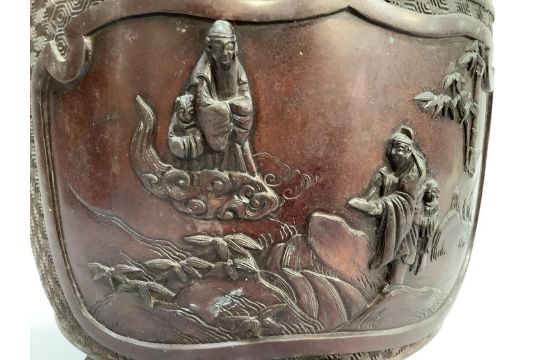 A Japanese bronze jardiniere cast with two reserves containing birds and scholars in heavy relief - Image 4 of 5