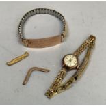 An Accurist lady's manual wristwatch in 9ct. gold case on a later rolled gold bracelet. together