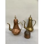 Two Middle eastern coffee pots in copper and brass, each with domed cover and finial together with a