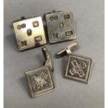 Two pairs of silver cufflinks both featuring commemorative hall marks, both of square out line on