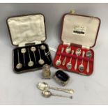 A boxed set of George V silver tea and coffee spoons together with a pair of George V salt and