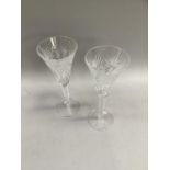 Pair of Waterford crystal Millennium champagne glasses, the bowls star cut, 23.5cm high