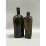 Oval green moulded glass bottle stamped with 'W&A Gilbey Ltd.' c.1810 30cm high together with a