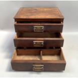 20th century oak stationary box with drop front slope, interior fitted with letter rack, four