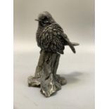 A white metal model of a robin, 10cm high