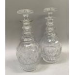 Pair of triple collar necked decanters, slice cut to shoulder above band of fan detailing, with