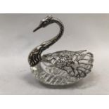 A silver and cut glass trinket jar in the form of a swan, cut glass body with silver neck, head