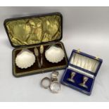 A boxed pair of Victorian silver scallop butter dishes with frosted glass liners and associated