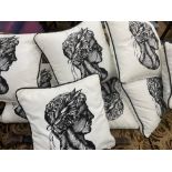 Eight black and white scatter cushions printed with a Roman male bust.