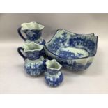 Three 19th century blue and white ironstone jugs in graduated sizes together with a large bowl