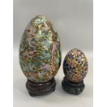 Chinese cloisonne egg enamelled with exotic birds and gilt on carved rosewood stand together with
