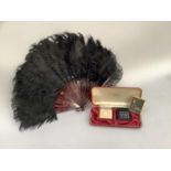 Black ostrich feather fan with faux tortoiseshell sticks and two ladies evening lighters by Colibri