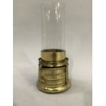 A brass based oil lamp with cylindrical glass lamp engraved to the front Darling Registered and