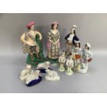 Pair of 19th century Staffordshire flatback figures of man and woman in tartan, another of a