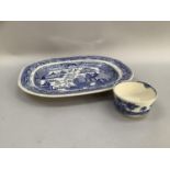 19th century blue and white pearlware dish in Willow pattern, together with blue and white slop bowl