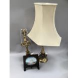 Pair of Nigerian brass lamps with banded stands and white shades 70cm high together with Eastern