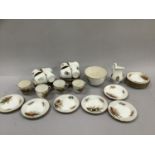 A Victorian tea set comprising twelve cups, twelve saucers, twelve side plates, slop bowl and milk