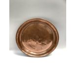 Large copper charger with dished centre 53cm diameter