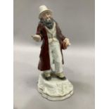 Staffordshire figure of a pedlar in red robe on base, 27cm high A/F