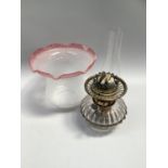 Evered's brass oil lamp with cranberry tinted shade, 40cm high