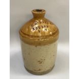 Stoneware flagon, brown glaze dipped impressed with 'J.B Holden and Co. Bolton, 1.G', 30cm high