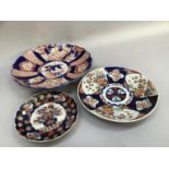 A large Imari charger of typical decoration with scalloped rim, 37.5cm diameter, together with a