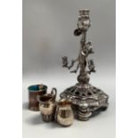 A 19th. Century continental silver candlestick. The rustic and foliate stem with three sconces and