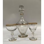 A Legras 'Polecat' Art Deco design decanter 30cm high and glasses, the decanter with gilt detailing,