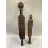 Pair of hand carved Tuareg tent poles carved with tribal, geometric designs. Approx. 99cm